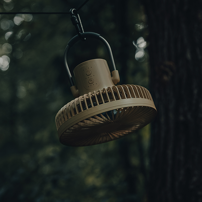 camping fan hanging under tarp shelter