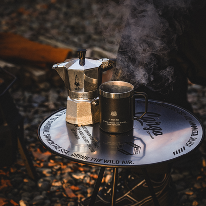 Portable camping table used as a camp kitchen for outdoor cooking
