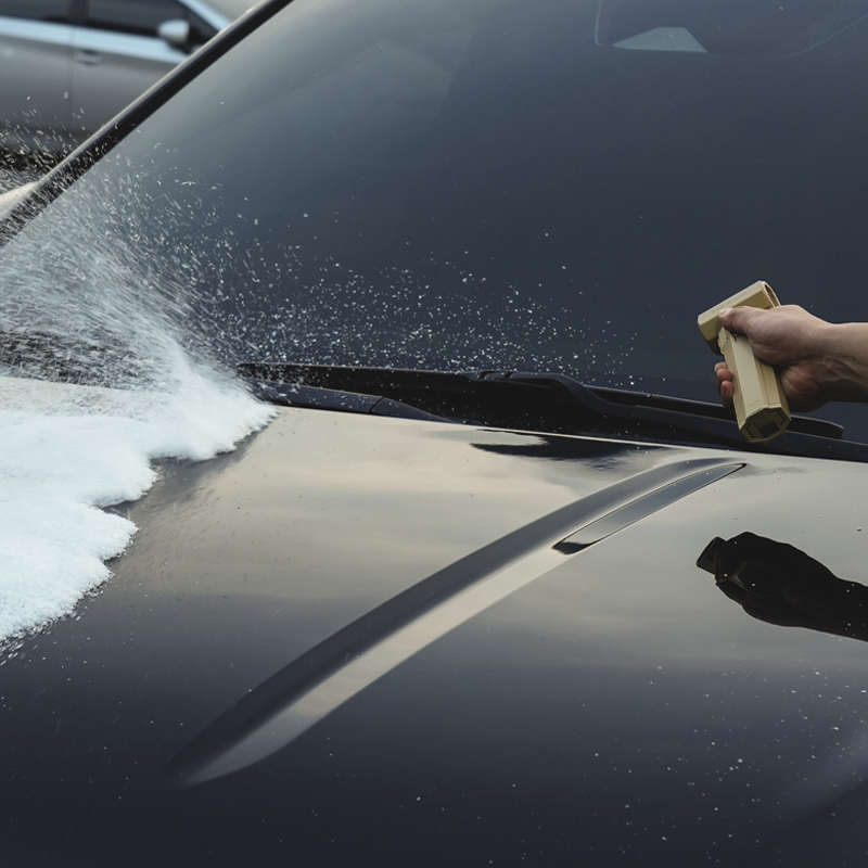 Portable air blower drying a vehicle after washing without touching the paint